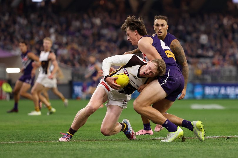 PERTH, AUSTRALIA - MAY 07: James Sicily of the Hawks is tackled by Jye Amiss of the Dockers during the round nine AFL match between Fremantle Dockers and Hawthorn Hawks at Optus Stadium, on May 07, 2026, in Perth, Australia. (Photo by Janelle St Pierre/AFL Photos/via Getty Images)