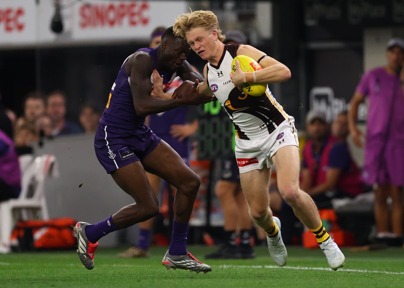 PERTH, AUSTRALIA - MAY 07: Bodie Ryan of the Hawks breaks from a tackle by MFduring the round nine AFL match between Fremantle Dockers and Hawthorn Hawks at Optus Stadium, on May 07, 2026, in Perth, Australia. (Photo by Paul Kane/Getty Images)