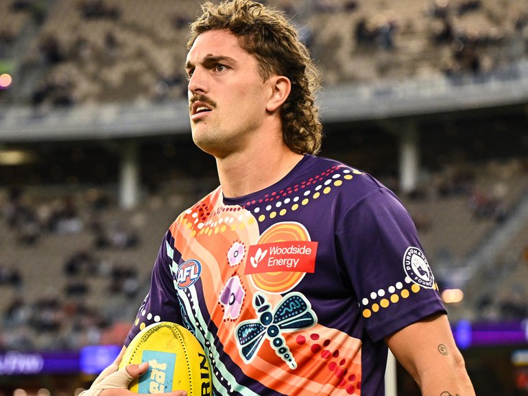 Luke Jackson of the Dockers warms up.