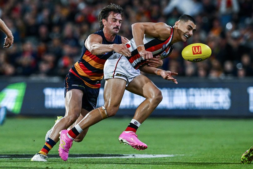 ADELAIDE, AUSTRALIA - APRIL 18: Lance Collard of the Saints tackled by Luke Nankervis of the Crows during the round six AFL match between Adelaide Crows and St Kilda Saints at Adelaide Oval, on April 18, 2026, in Adelaide, Australia. (Photo by Mark Brake/Getty Images)