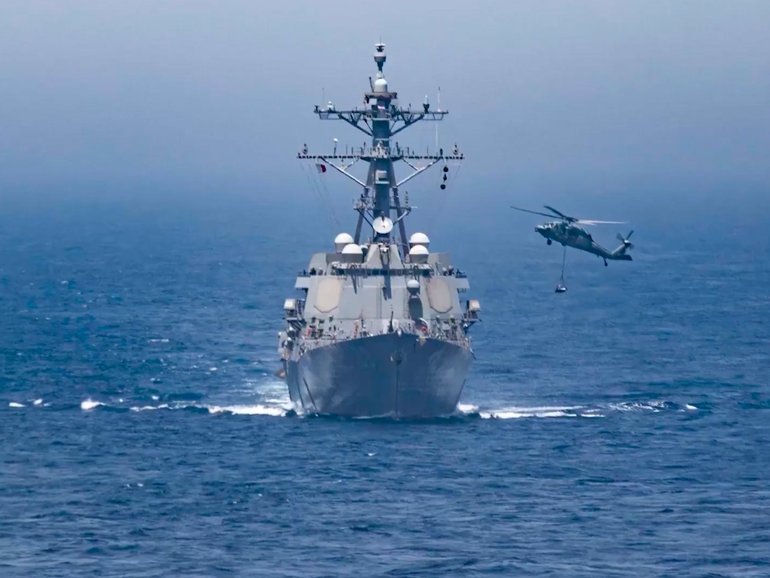 Images released by US Central Command, which says  Iranian forces launched “multiple missiles, drones and small boats” at the three US warships.