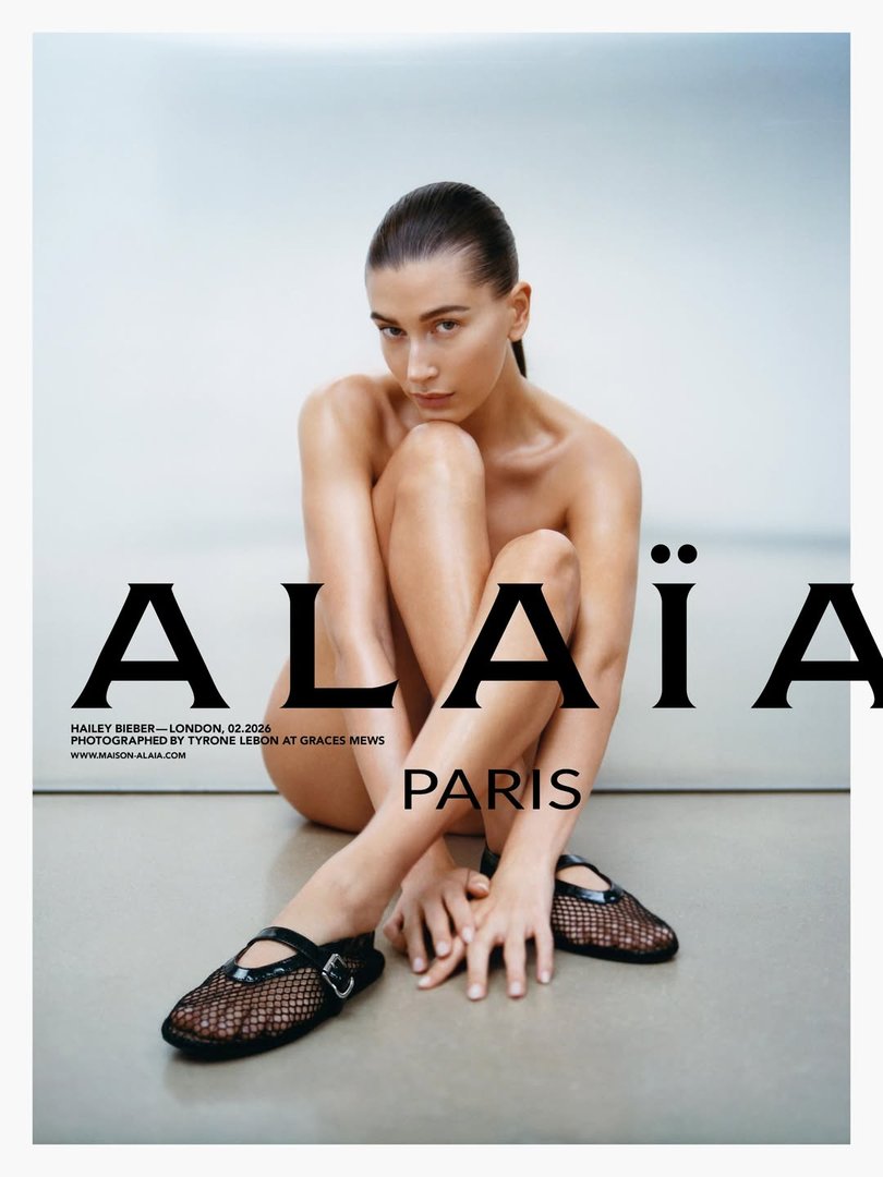 Hailey Bieber strategically poses in nothing but black shoes.