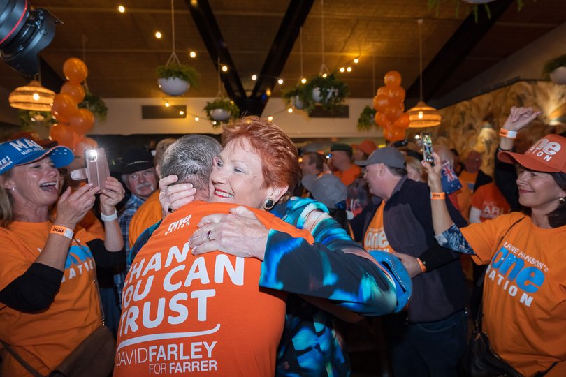 Pauline Hanson and David Farley celebrate with supporters in Albury.