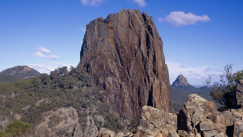 Two climbers became stranded on Crater Bluff in the Warrumbungles National Park after a falling rock struck one of them in the head.