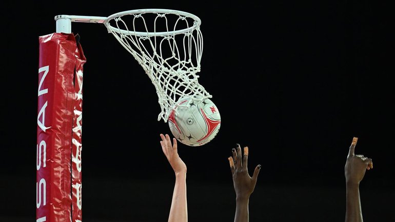 Police have charged a woman over alleged anti-Semitic comments at a children's netball game. 