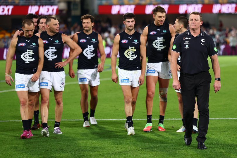 BRISBANE, AUSTRALIA - MAY 08: Michael Voss, Senior Coach of the Blues and the team leave the field after the round nine AFL match between Brisbane Lions and Carlton Blues at The Gabba, on May 08, 2026, in Brisbane, Australia. (Photo by Chris Hyde/AFL Photos/via Getty Images)