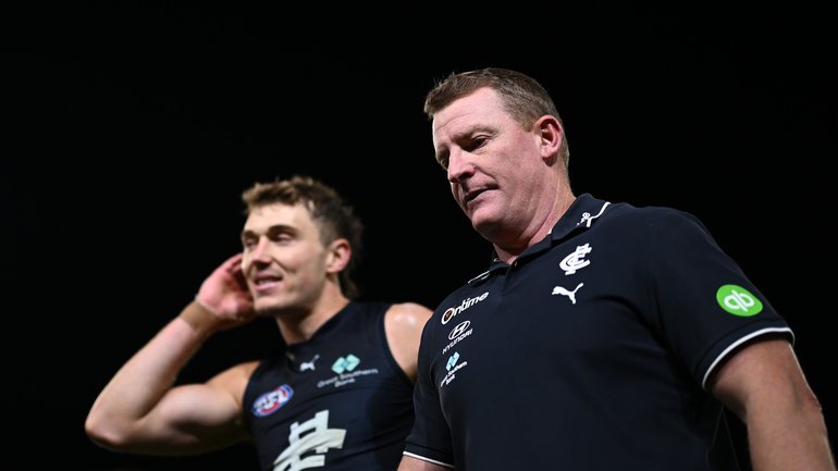 Michael Voss looks on after his team's defeat to Brisbane