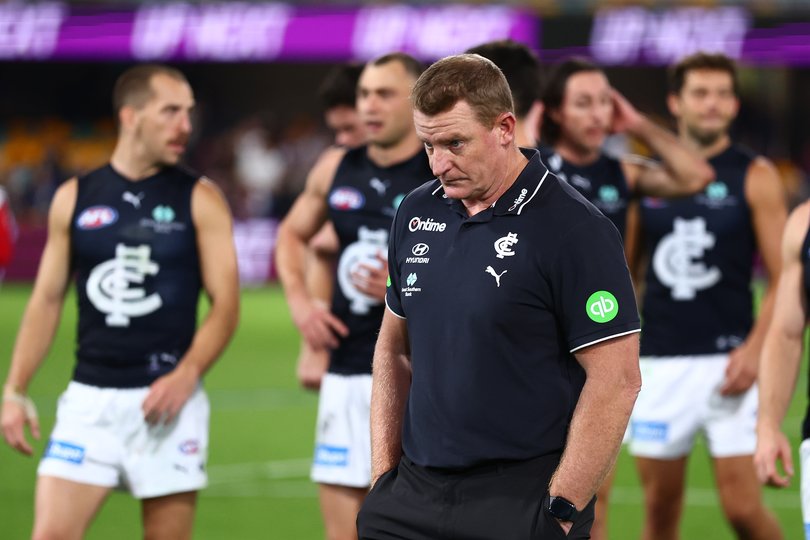 BRISBANE, AUSTRALIA - MAY 08: Michael Voss, Senior Coach of the Blues and the team leave the field after the round nine AFL match between Brisbane Lions and Carlton Blues at The Gabba, on May 08, 2026, in Brisbane, Australia. (Photo by Chris Hyde/AFL Photos/via Getty Images)