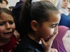 Children cry at the funeral for the Palestinian man shot  trying to climb the wall to find work. (AP PHOTO)
