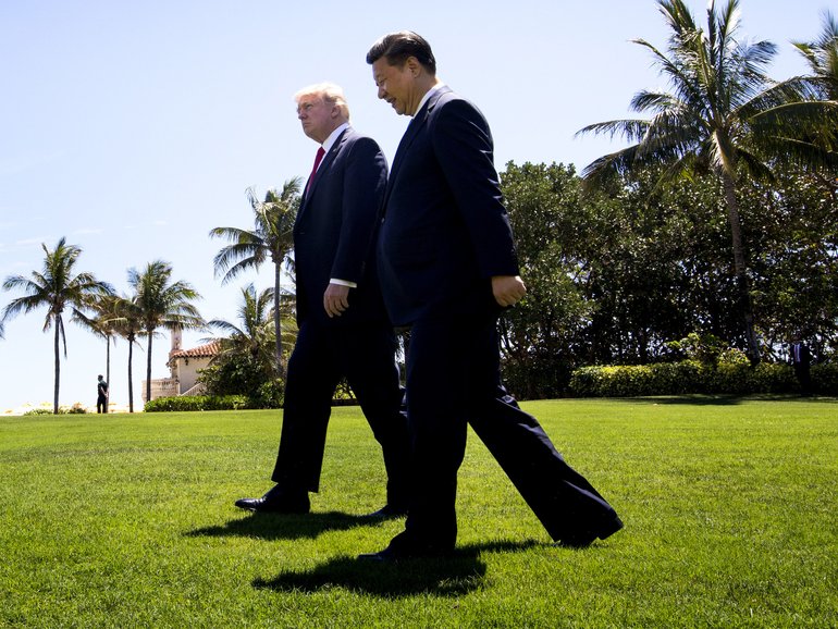 President Donald Trump walks with President Xi Jinping of China at his Mar-a-Lago resort in 2017.