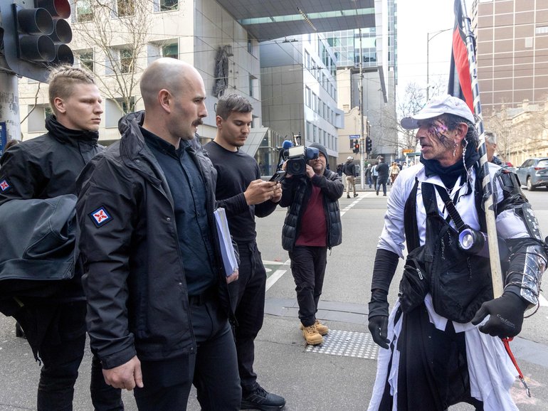 Neo-nazi leader Thomas Sewell is confronted by Aboriginal activist Larry Dowling outside Magistrates court. 