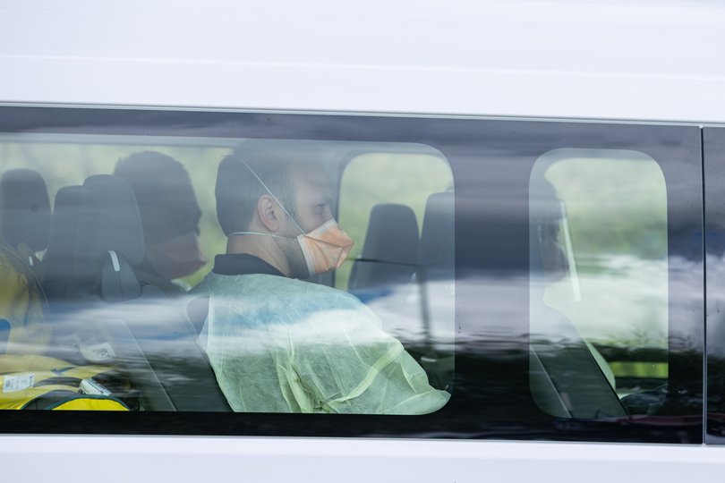 Medical staff and aircraft crew arrive at Bullsbrook Quarantine Centre on Friday.