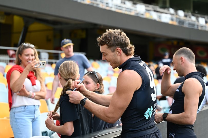 Patrick Cripps of the Blues interacts with fans