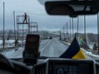 Soldiers install anti-drone netting over a road between Izium and  Sloviansk, in the Donetsk region of Ukraine, March 6, 2026. 