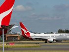 A long-haul Qantas flight was diverted after a passenger allegedly bit a flight attendant, forcing the removal of the man.