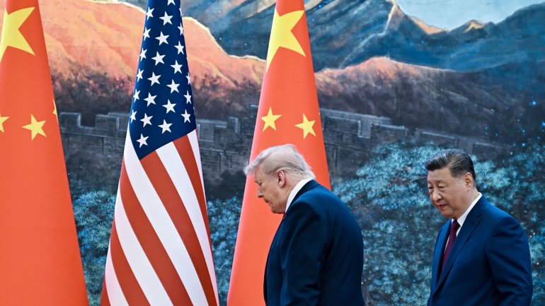President Xi Jinping of China walks with President Donald Trump at the Great Hall of the People in Beijing during their two-day summit, on Thursday, May 14, 2026. 