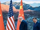 President Xi Jinping of China walks with President Donald Trump at the Great Hall of the People in Beijing during their two-day summit, on Thursday, May 14, 2026. 