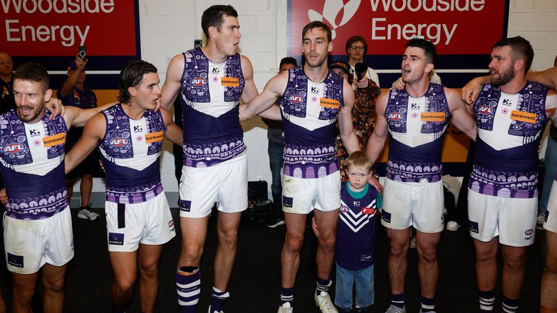 The Dockers sing their team song.