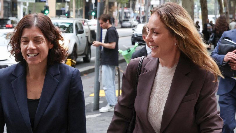 Cate Sayers (right) walks out of court with her lawyer Sue Chrysanthou. NewsWire / David Caird