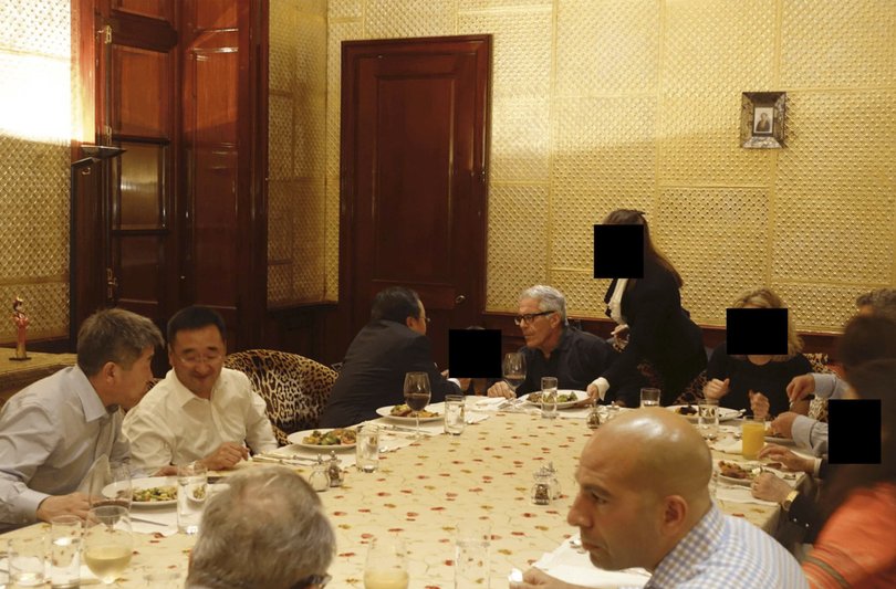 A photo provided by the U.S. Department of Justice shows Jeffrey Epstein with unidentified others at a dinner party at his home in New York. Epstein’s Manhattan townhouse became the venue for dinners with wealthy and powerful guests. (U.S. Department of Justice via The New York Times) — NO SALES. FOR EDITORIAL USE ONLY —