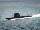 A Collins-class submarine heading out to sea from Fleet Base West. 