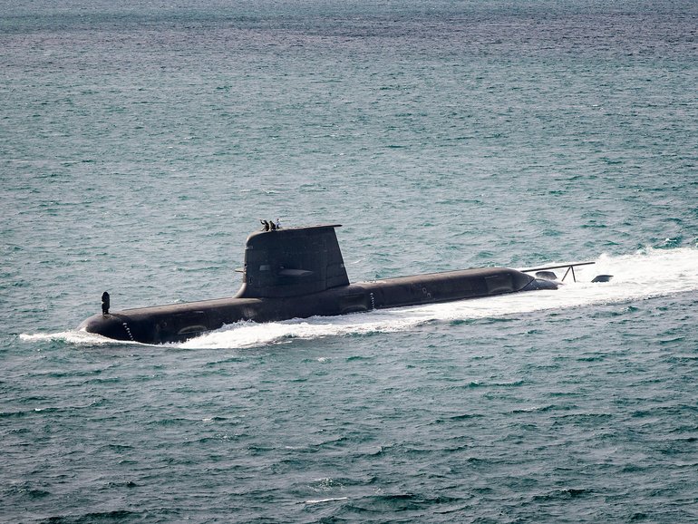 A Collins-class submarine heading out to sea from Fleet Base West. 