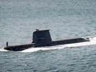 A Collins-class submarine heading out to sea from Fleet Base West. 
