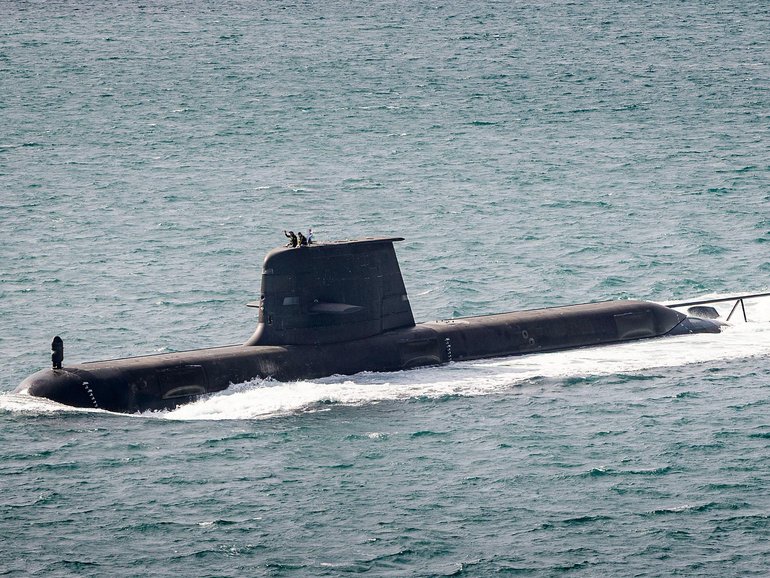 A Collins-class submarine heading out to sea from Fleet Base West. 