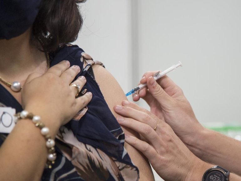 A drop in vaccinations has been blamed for the widespread outbreak of a respiratory disease. 