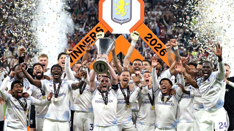 Aston Villa players with the trophy after their 3-0 win over Freiburg in Istanbul. 