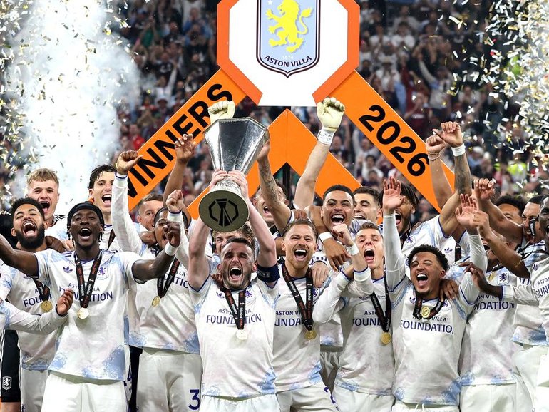 Aston Villa players with the trophy after their 3-0 win over Freiburg in Istanbul. 