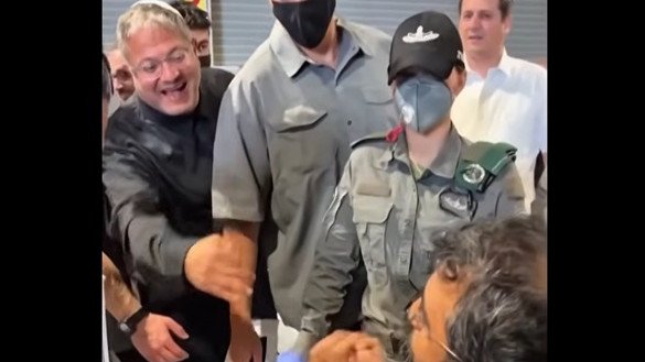 Images from the video posted by Israeli minister Ben-Gvir showing detained Gaza flotilla activists being taunted and bound.