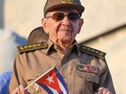 Cuba's former President Raul Castro holds a Cuban national flag during the commemoration of May Day (Labour Day), marking International Workers' Day, at Havana's Revolution Square on May 1, 2025. (Photo by YAMIL LAGE / AFP) YAMIL LAGE