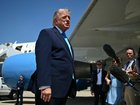 President Donald Trump speaks to reporters after stepping off Air Force One.