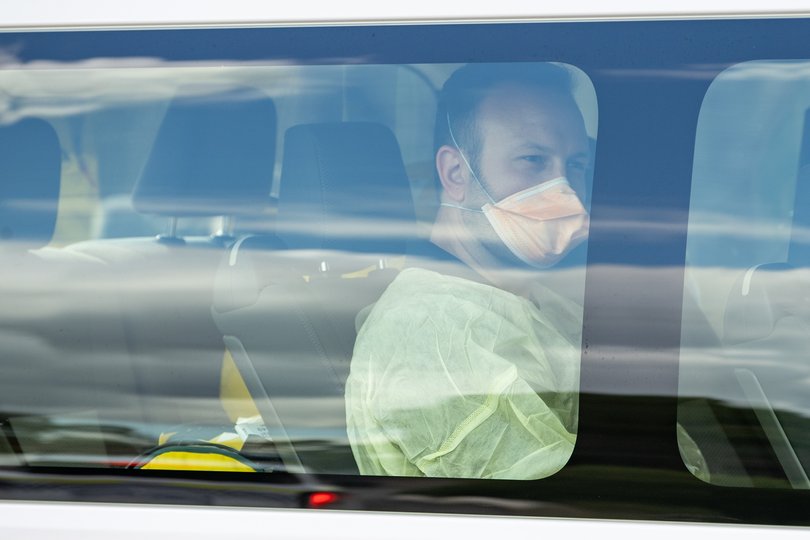 Medical staff and aircraft crew arrive at Bullsbrook Quarantine Centre after transporting passengers from the hantavirus-stricken cruise ship MV Hondius.