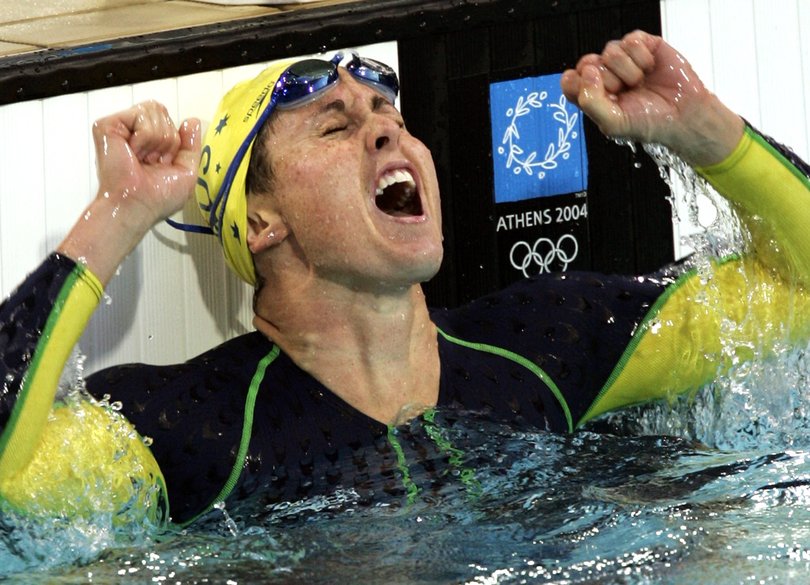 Petria Thomas, of Australia, celebrates after winning a gold medal in the 100-meter butterfly at the Olympic Aquatic Centre during the 2004 Olympic Games in Athens, Sunday Aug. 15, 2004.