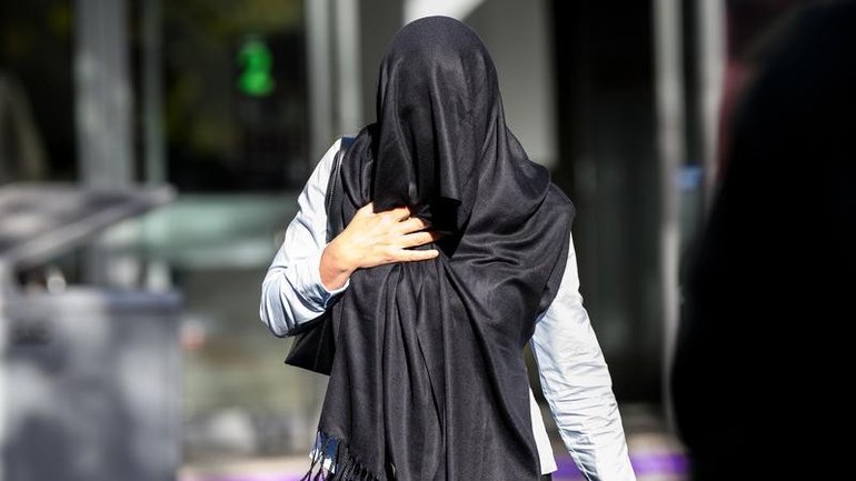 Julie Minter and a colleague have avoided convictions after assaulting a toddler in their care. 