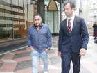 Trindall (L) and his lawyer James Drewett (R) left the Downing Centre Local Court on Friday after the ex-NRL star was sentenced to a 12-month community order. NewsWire / Christian Gilles