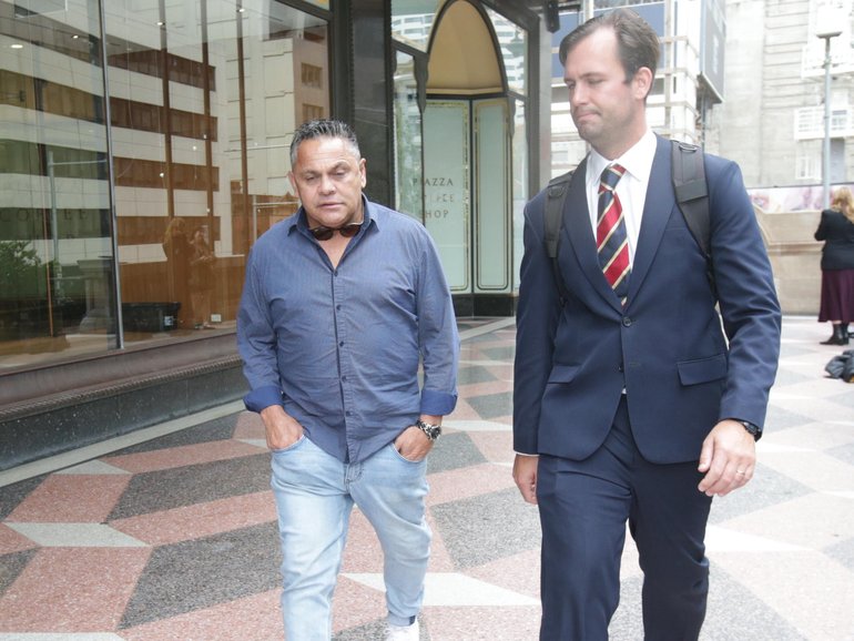Trindall (L) and his lawyer James Drewett (R) left the Downing Centre Local Court on Friday after the ex-NRL star was sentenced to a 12-month community order. NewsWire / Christian Gilles