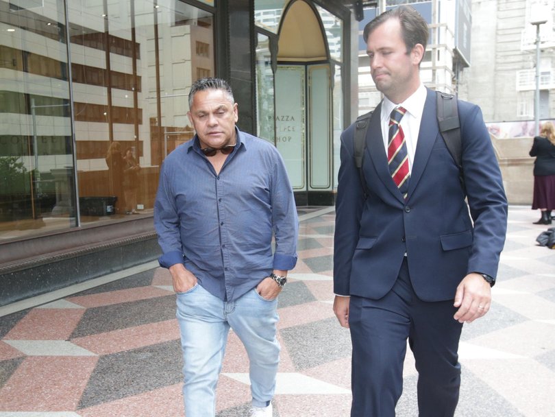 Trindall (L) and his lawyer James Drewett (R) left the Downing Centre Local Court on Friday after the ex-NRL star was sentenced to a 12-month community order. Picture: NewsWire / Christian Gilles