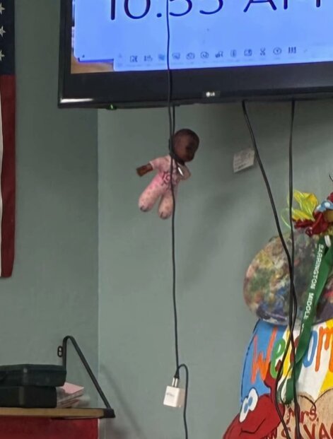 Ms Savage tied the doll up with the TV cord.