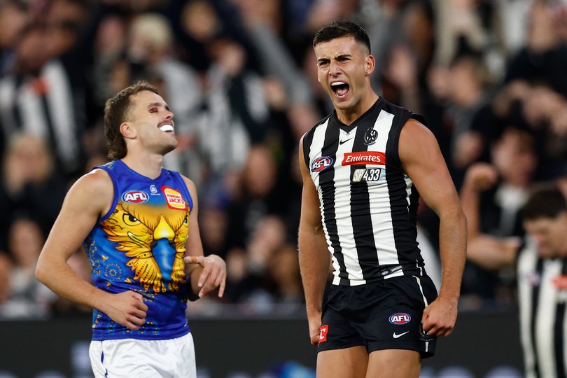 Nick Daicos of the Magpies celebrates a goal.