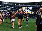 Scott Pendlebury walked out on to the MCG for his milestone match with his children Darcy and Jax. (Dylan Burns/AAP PHOTOS)