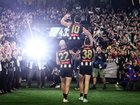 Scott Pendlebury of the Magpies chaired off by Steele Sidebottom and Jeremy Howe.