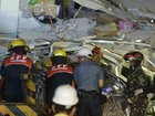 More than 100 police and other government personnel are scrambling to rescue those who are trapped.