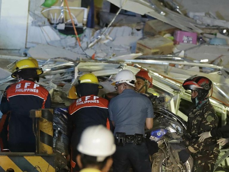 More than 100 police and other government personnel are scrambling to rescue those who are trapped.