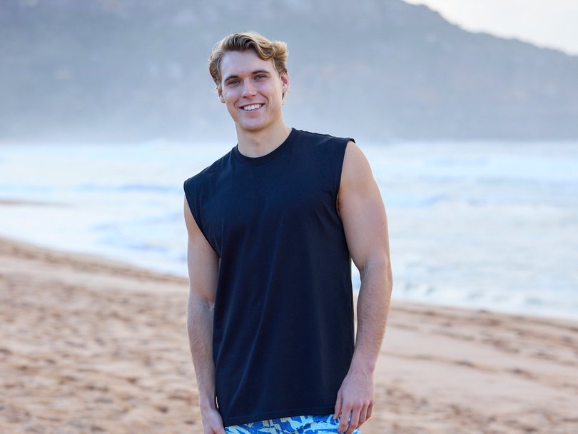 Rocco Forester-Sach in his boardies on Palm Beach, where the show is shot.