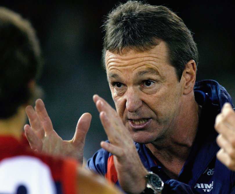 Melbourne coach Neale Daniher speaks to his players during an AFL match against the Western Bulldogs in 2006.