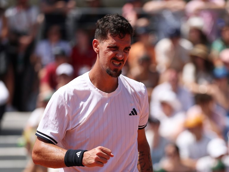Thanasi Kokkinakis has pulled off a win in another of his five-set Roland Garros epics.