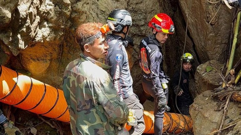 Divers have been navigating flooded sections of the cave to look for survivors. 